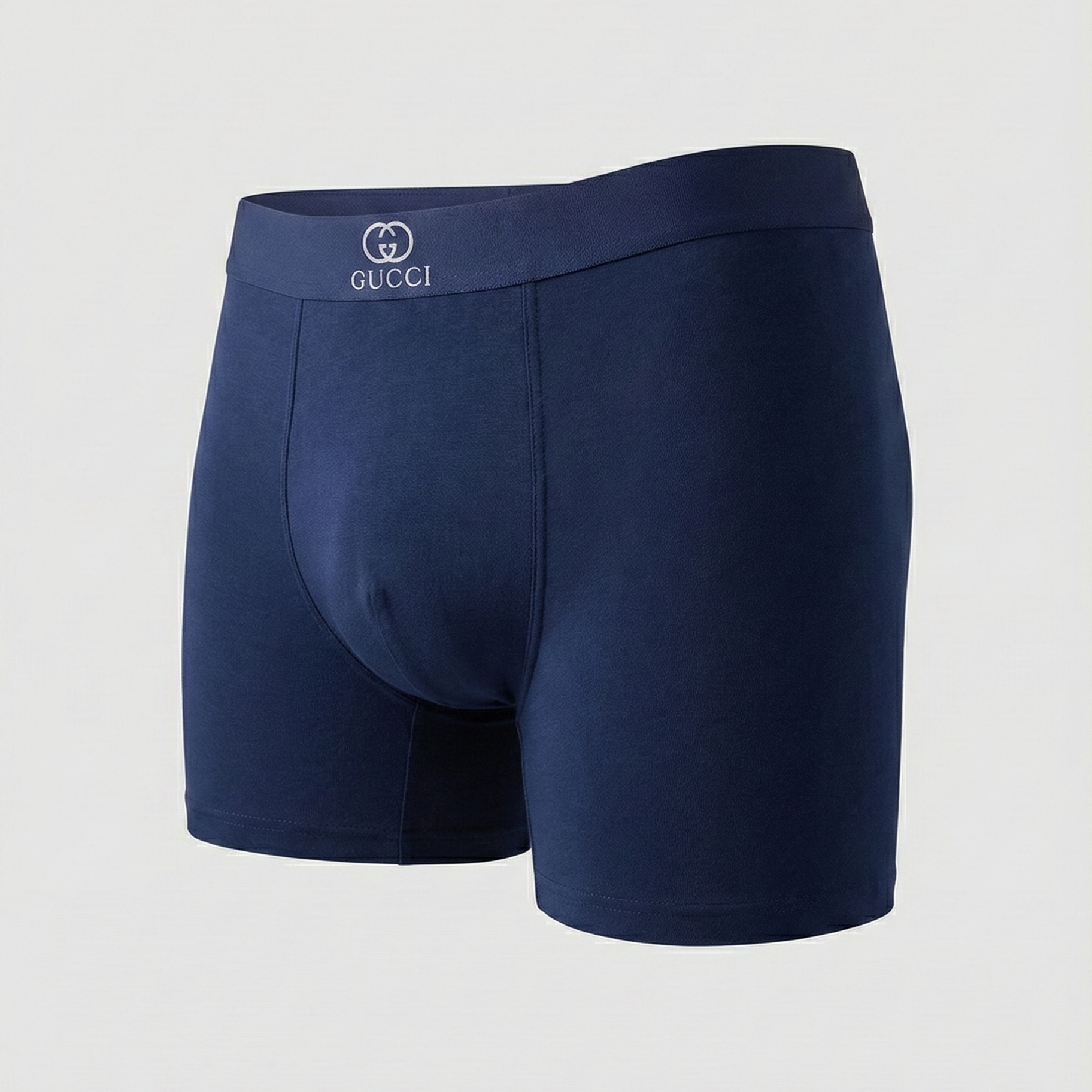 Navy blue Gucci boxer briefs on a light gray background